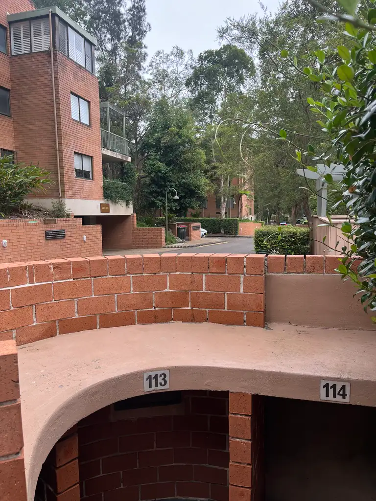 The same bin enclosure after cleaning, empty with clean brick and render