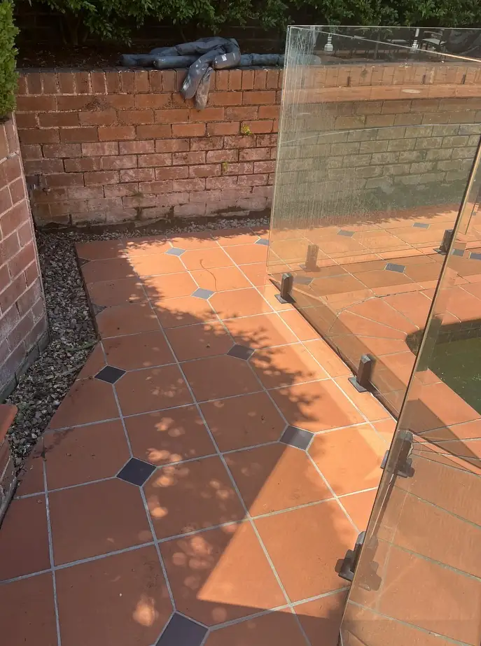 The same walkway after cleaning, the terracotta tiles back to orange
