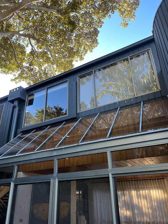 Commercial glazing cleaned with a water-fed pole